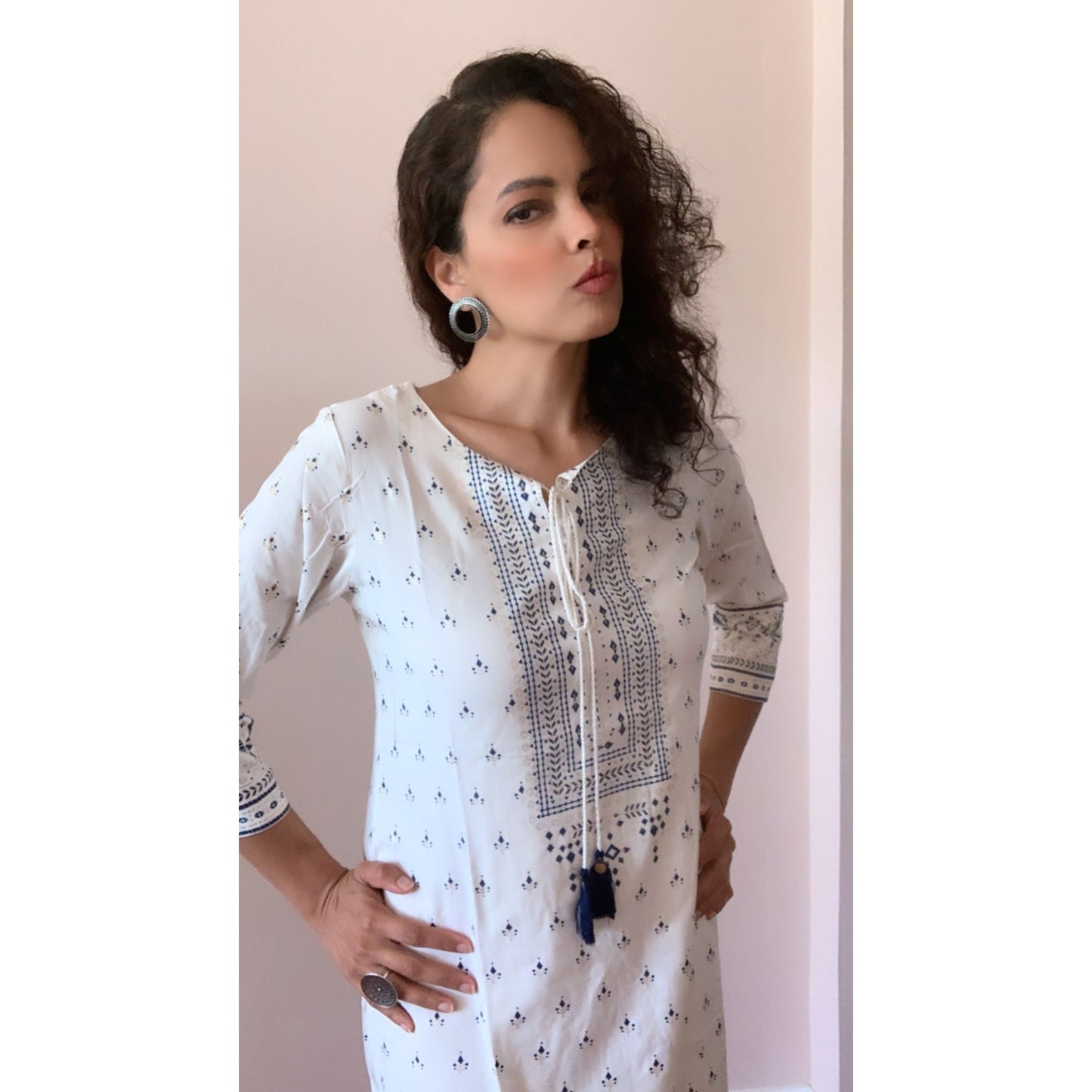 Soft and silky white kurta with blue prints all over. Casual everyday wear Kurtas that can be worn on jeans. 3/4th sleeve kurti with dori strings. 