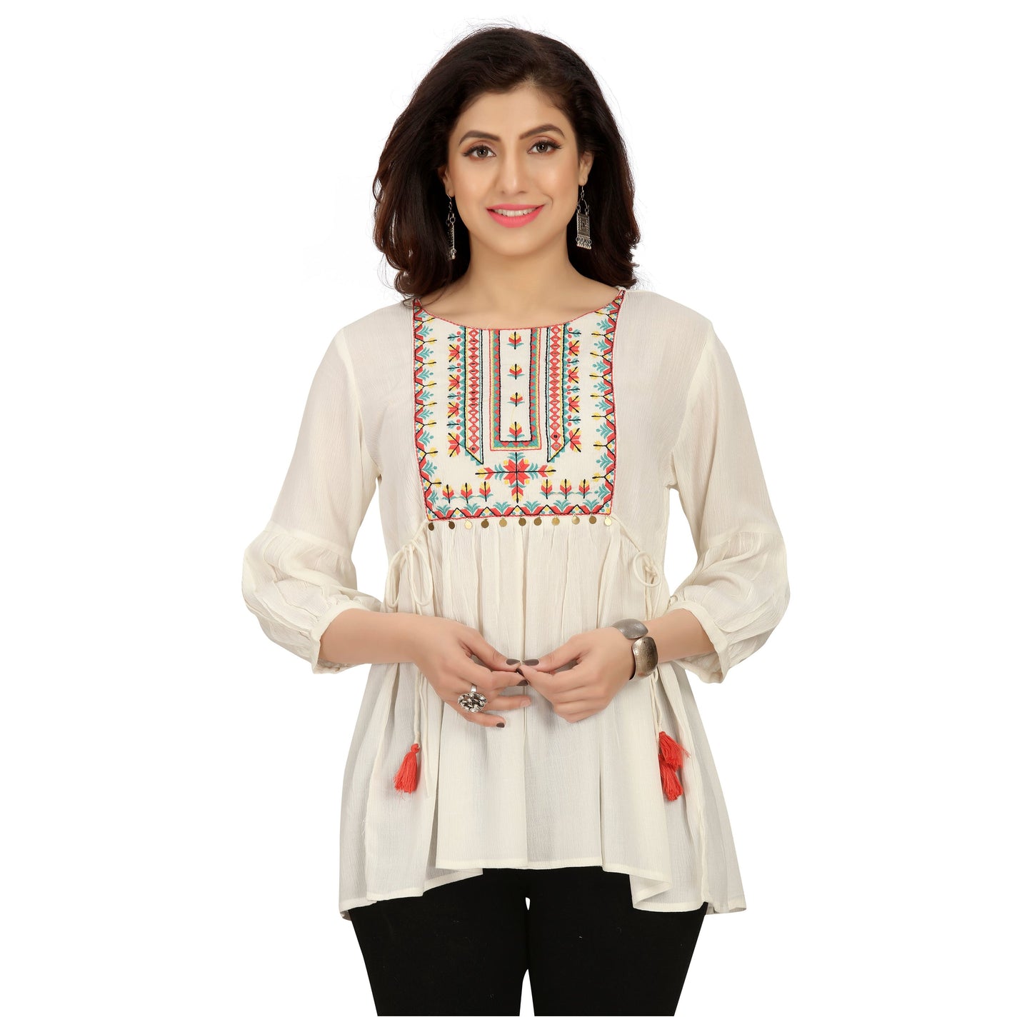 White short kurti with delicate embroidery on the neckline. Tunic top can be worn over jeans or skirt. Boho chic appeal to this Kurti with tassels on the side. 