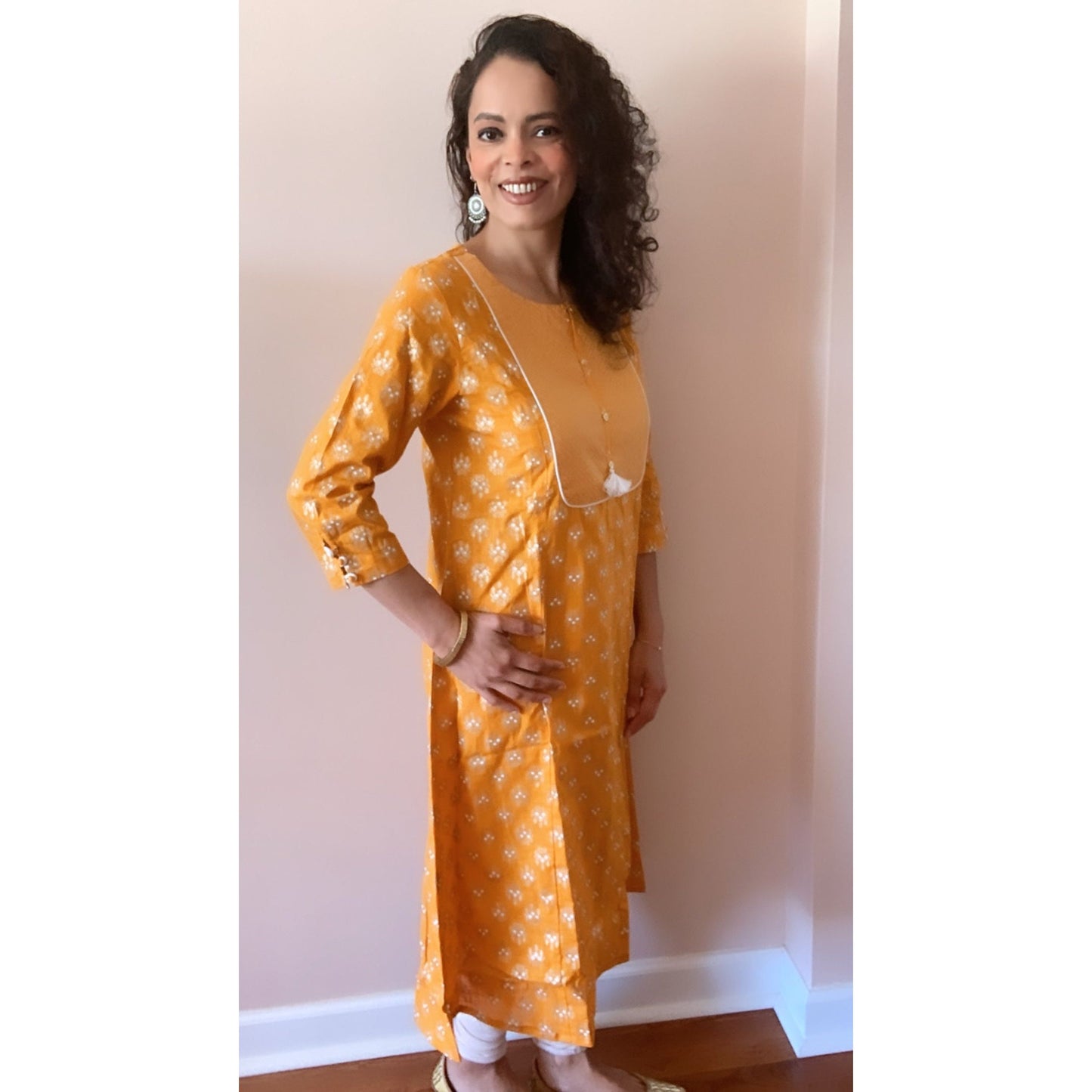 Sunshine yellow with white prints and a beautiful neckline. Comfortable Cotton Kurta for everyday wear.  