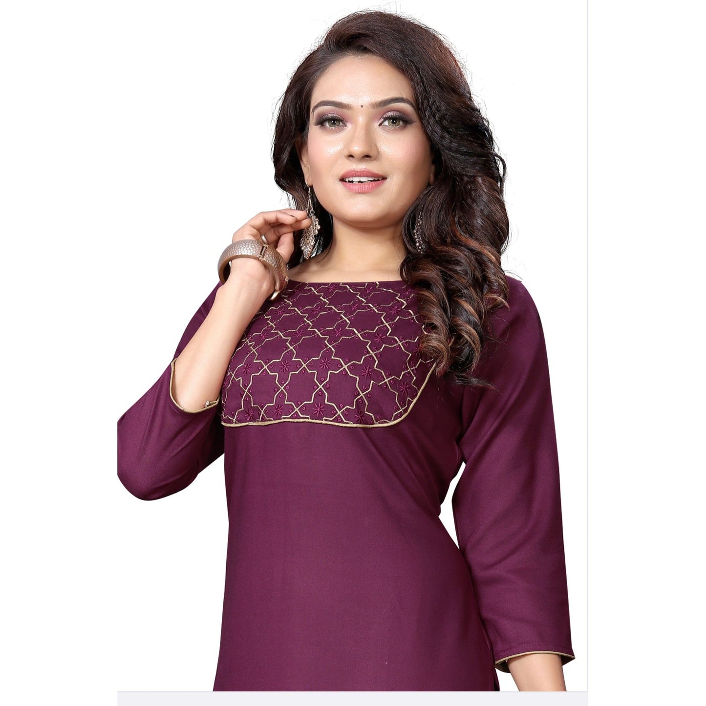 Plum colored kurti with gold piping on the neckline. Simple and graceful Kurtas for all occasions. 