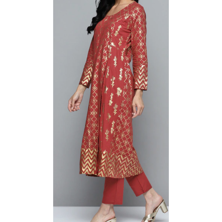 Maroon and gold prints Kurta with matching pants. The kurti has long slits on the sides and is uber chic and stylish. Perfect for parties and festivals. Festive wear kurta sets. 